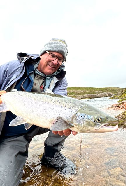 Angler with a catch in Iceland